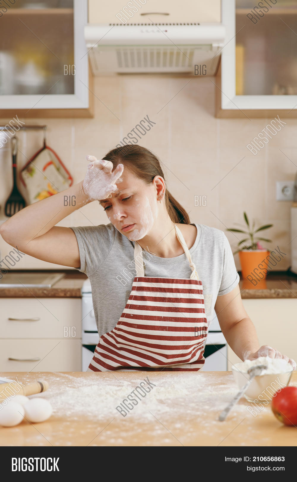 30-35years,adult,apple,apron,bake,bakery,baking,beautiful,bread,cake,caucasian,cook,cookie,cuisine,domestic,dough,eggs,emaciated,female,flour,food,girl,home,homemade,household,housewife,indoors,ingredient,insomnia,interior,iron,kitchen,meal,mixing,pandowdy,pastry,pie,pin,preparing,recipe,rolling,sieve,sleep,sugar,table,tablet,tasty,tired,utensil,white,woman
