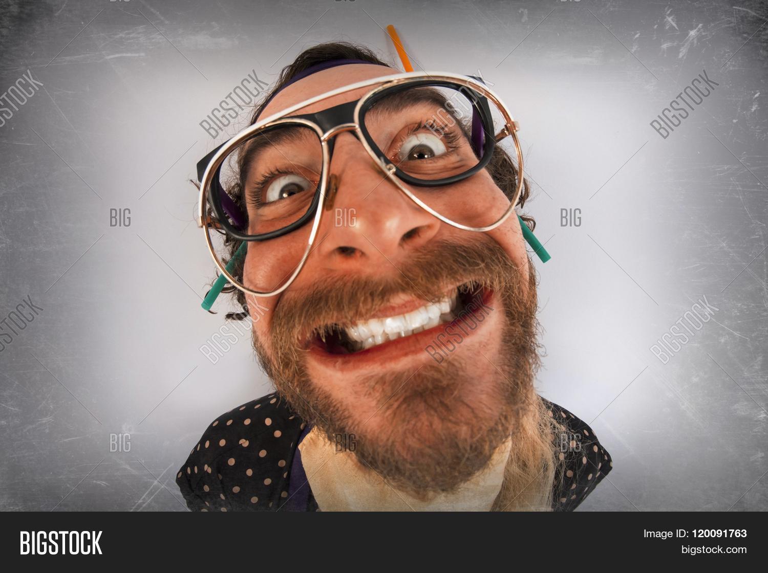 crazy,insane,lunatic,people,deranged,person,man,bearded,fish,eye,fisheye,smiling,happy,beard,madness,mad,insanity,guy,screaming,madman,psycho,mentally-ill,nutcase,crazed,adult,cuckoo,fashion,psychopath,facial,expression,silly,weirdo,wacky,glasses,lenses,nerd,pig,tails,straws,hairstyle,idiot,mind