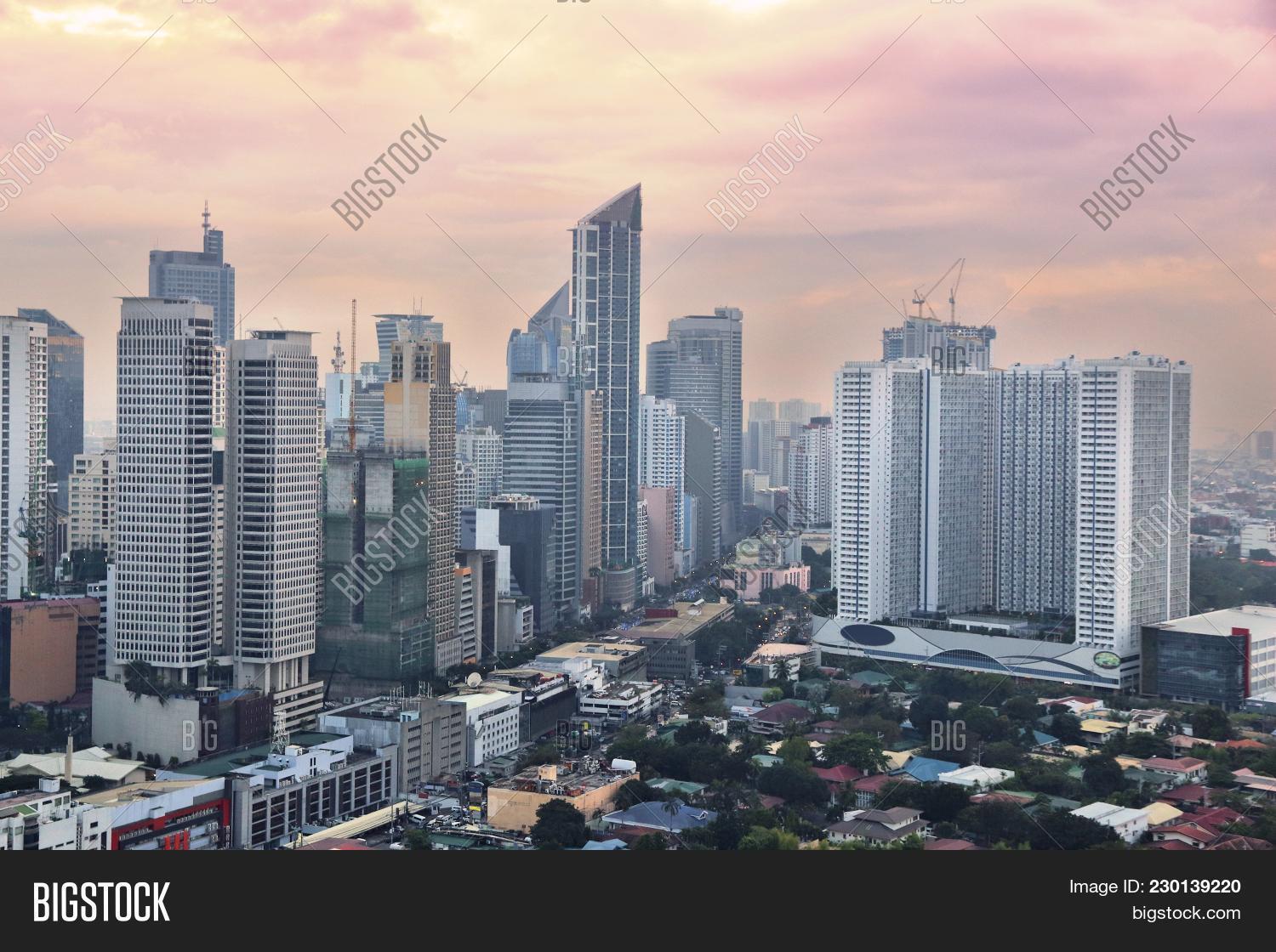 architecture,asia,building,capital,city,cityscape,destination,district,exterior,landmark,light,makati,manila,office,philippine,sightseeing,skyline,skyscraper,sundown,sunset,tourism,tower,town,travel