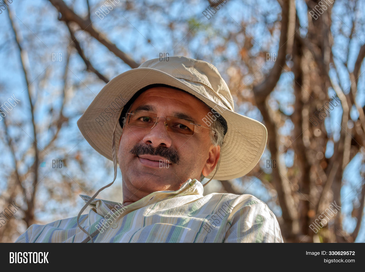 adult,alone,arabic,autumn,blue,break,businessman,busk,casual,caucasian,confident,face,forest,forties,glasses,gray,hand,happy,hispanic,holiday,iran,iranian,laugh,leave,leisure,lifestyle,looking,male,man,moustache,nature,old,one,optimistic,outdoor,outdoors,people,persian,person,portrait,positive,race,salt and pepper,shaved,shirt,single,smile,stylish,wilderness,wrinkles