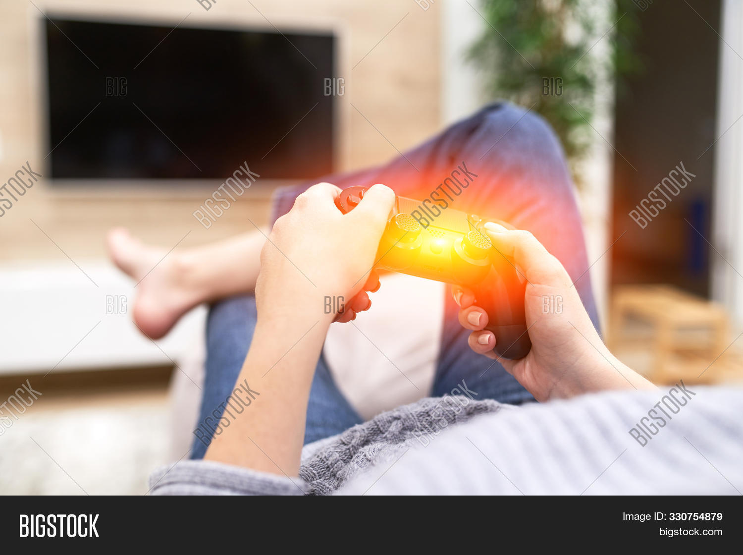 accessory,action,activity,addiction,adult,arm,competition,computer,console,controller,couch,electronic,entertainment,equipment,female,flare,fun,game,gamepad,gamer,gaming,girl,hand,happy,hobby,holding,holiday,home,joy,joypad,joystick,leisure,lying,nerd,pad,passion,play,player,relaxation,shooter,sofa,station,technology,tv,vacation,video,videogame,wife,wireless,woman