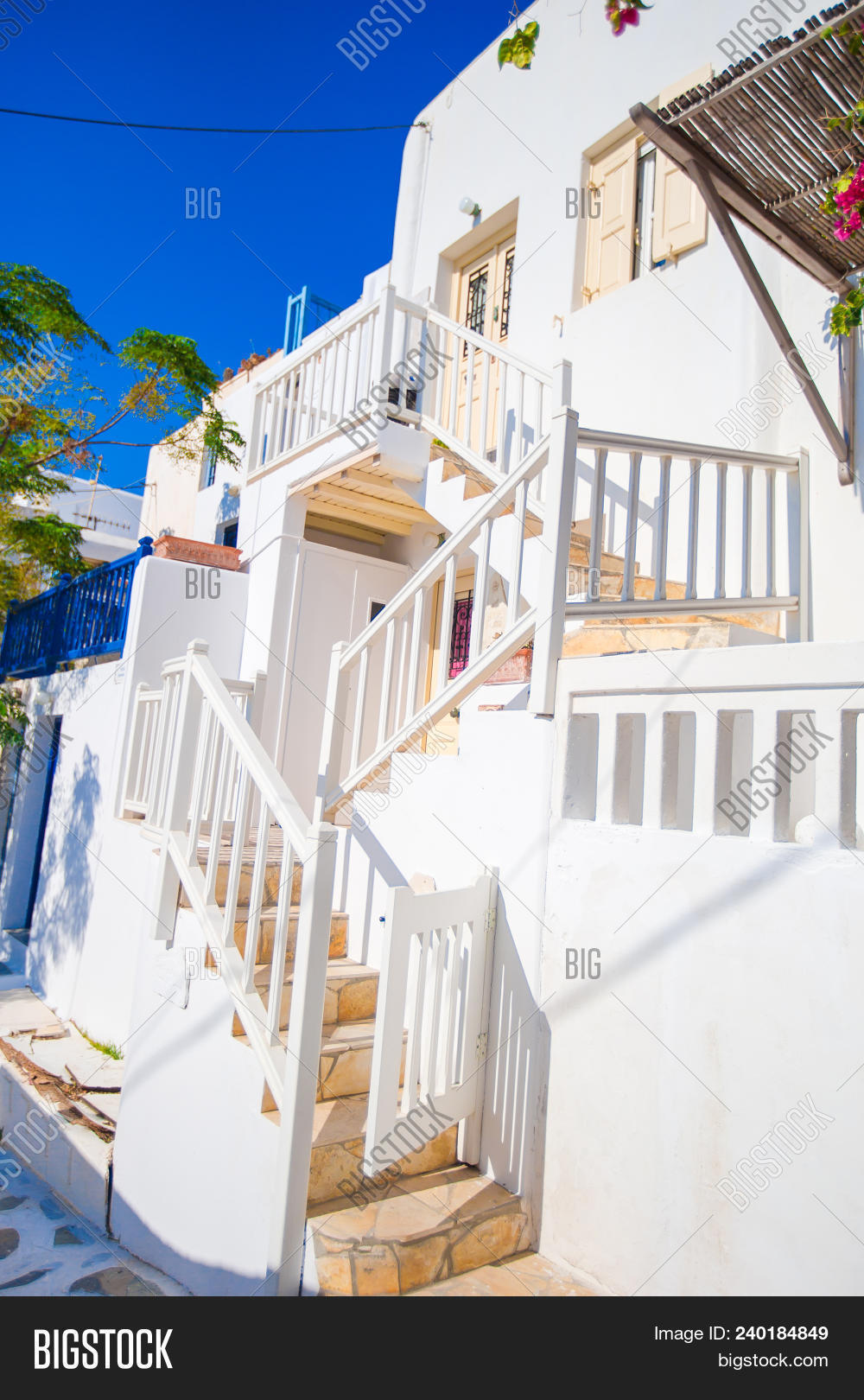 aegean,alley,architecture,balcony,beautiful,blue,bougainvilleas,bouganvilla,building,charter,clear,climate,construction,cyclades,doors,europe,family,flowers,greece,greek,holiday,home,hotel,house,island,mediterranean,mykonos,outdoors,railing,recreation,santorini,season,silence,south,stairs,steps,summer,sunlight,tourism,tourist,traditional,travel,tree,vacation,villa,village,wall,white,window