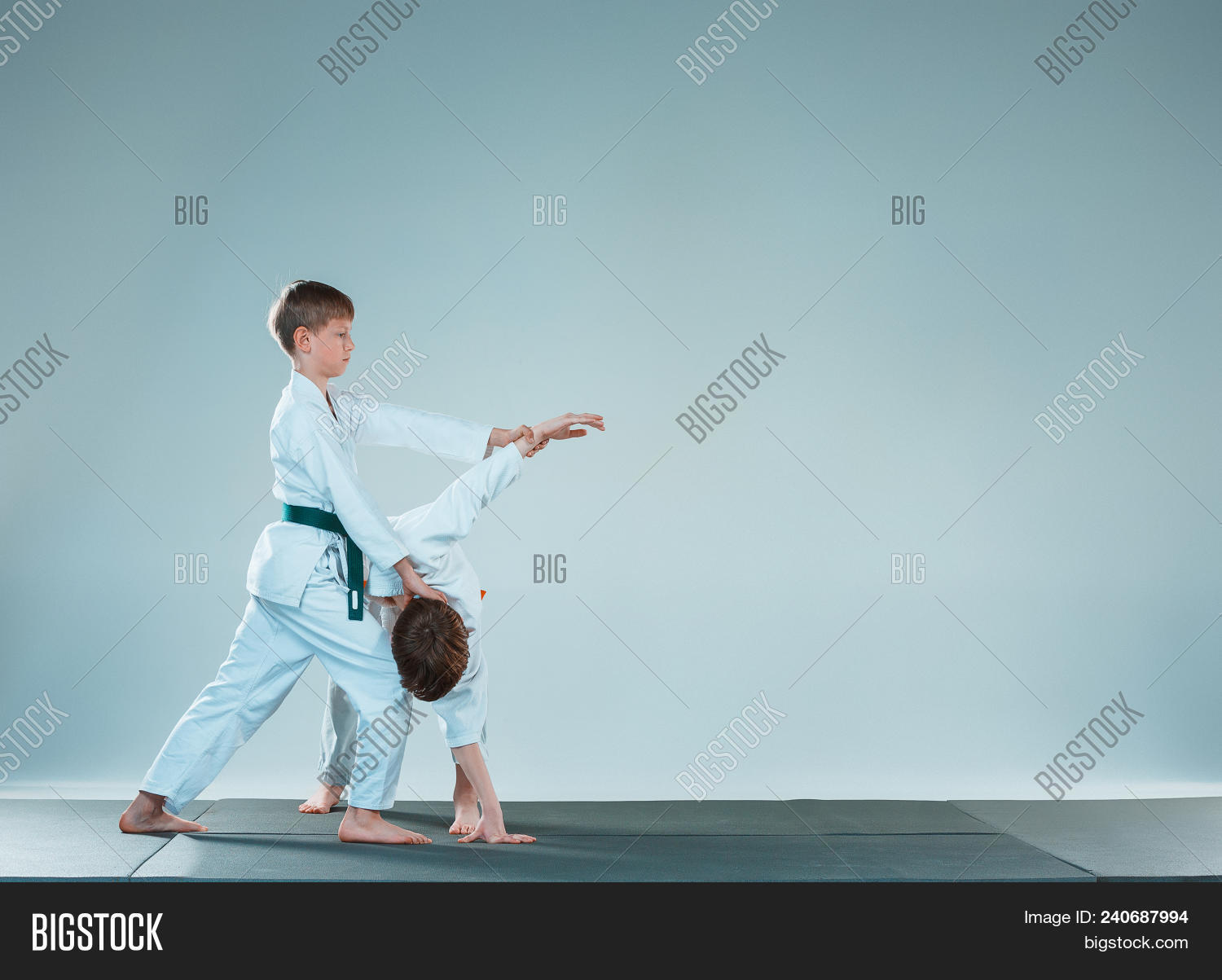 action,aggression,aikido,arts,audience,belt,black,caucasian,child,children,competition,competitive,culture,cute,defending,energy,exercising,fighting,fitness,hakama,hand,health,human,indoors,instructor,japanese,judo,karate,kid,kimono,lifestyle,male,man,martial,people,practice,protection,sport,tatami,teen,teenager,throw,throwing,traditional,training,two,uniform,white,young