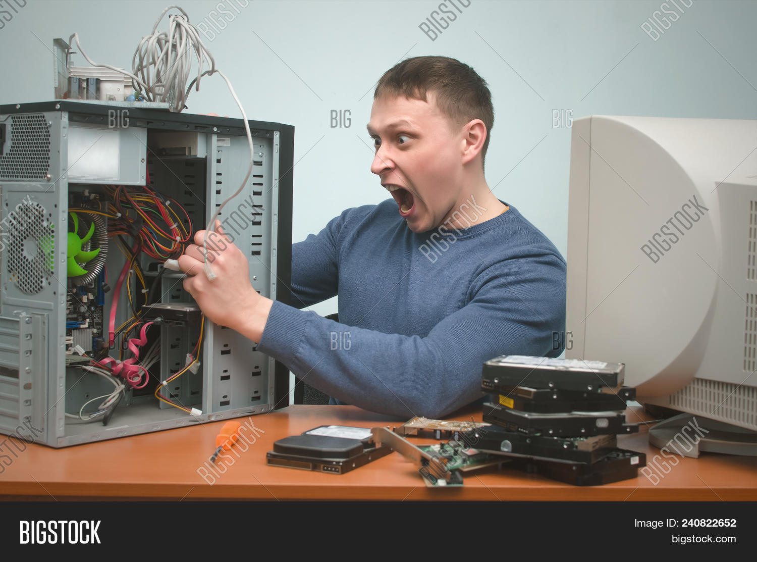 administrator,angry,assistance,background,brake,computer,concept,crazy,diagnostics,do,electronic,engineer,fix,frustrated,hands,hardware,help,holding,hysterics,it,male,man,master,network,overburdened,overloaded,overworked,pc,people,person,professional,programmer,recovery,repair,repairman,scream,service,sick,sitting,specialist,stress,support,system,table,technician,user,wicked,work,worker