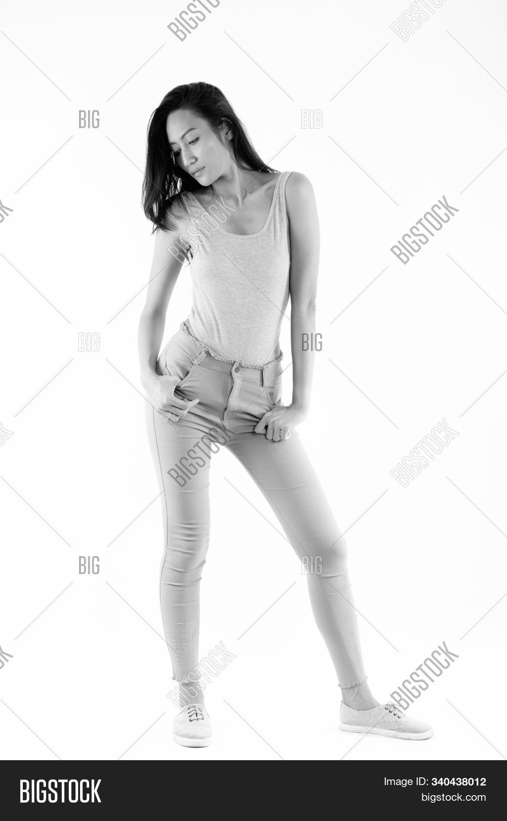 30s,adult,asian,attractive,away,background,beautiful,black,body,brown,female,full,indoors,inside,lady,length,looking,monochrome,people,person,portrait,posing,shadow,shot,standing,studio,thai,vertical,vintage,white,woman,young