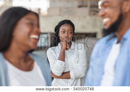 Upset Black Woman Watching Her Ex Boyfriend Happy In Relations With New Girlfriend, Looking Jealous