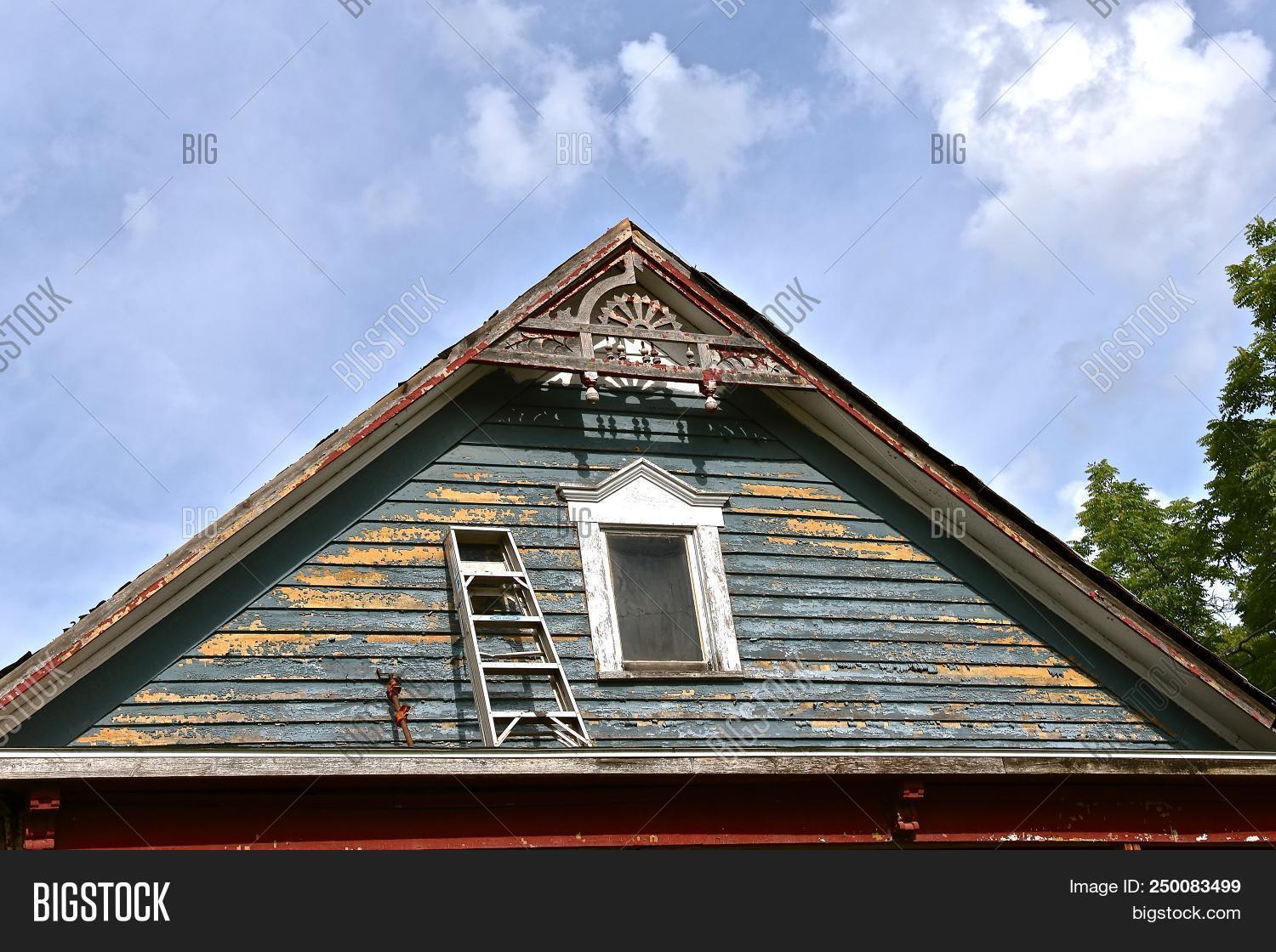architecture,climbing,dangerous,facia,home,house,improvement,ladder,old,paint,painting,peeling,porch,risky,roof,scraping,siding,step,stupid,trim