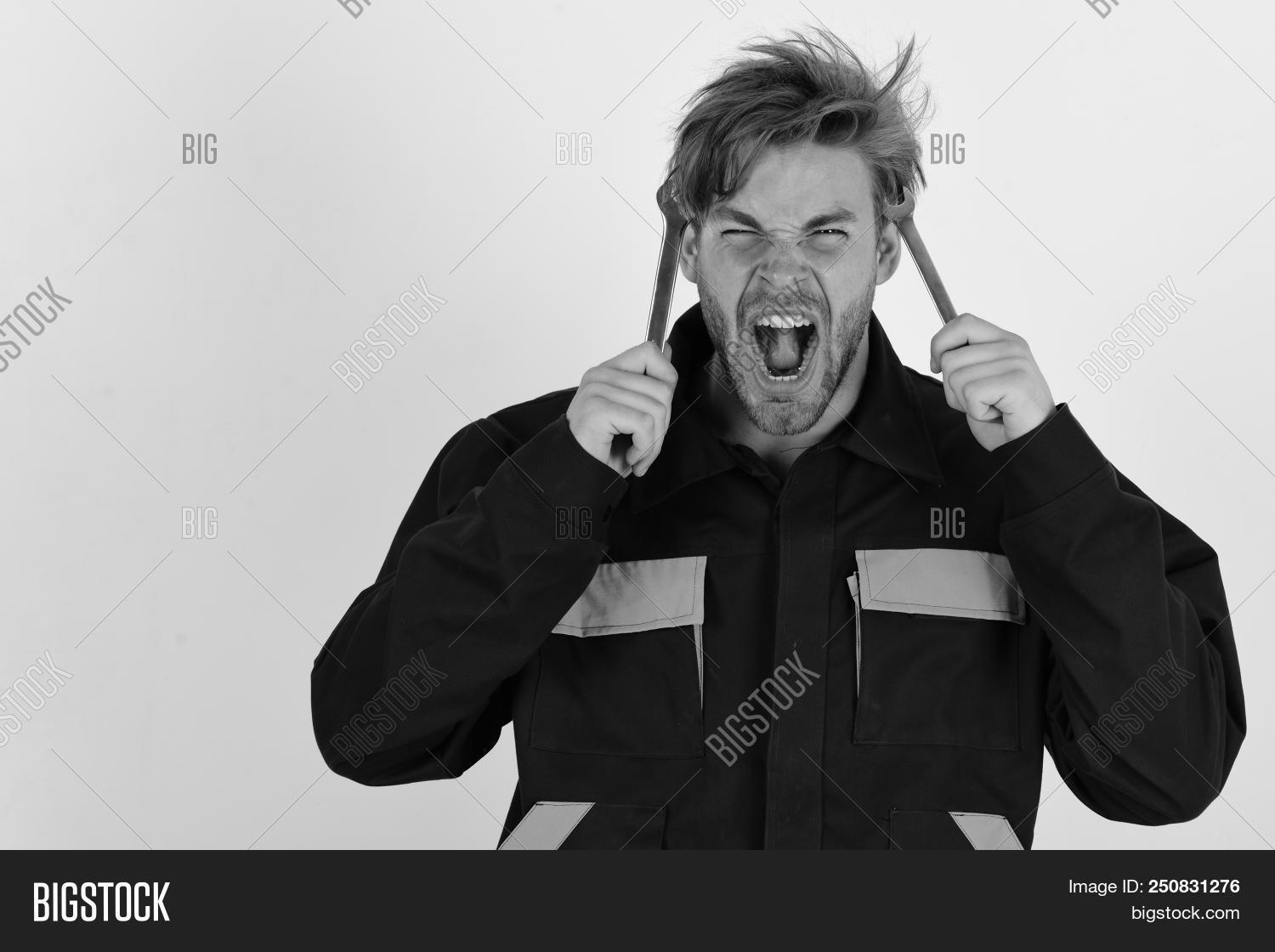 adjust,adjustable,background,caucasian,chrome,concept,construction,detail,engineer,engineering,equipment,face,fist,fix,hand,hardware,hold,instruments,isolated,job,key,maintenance,man,manual,mechanic,mechanical,metal,metallic,occupation,plumber,professional,repair,screaming,screw,screwdriver,service,silver,spanner,support,technical,technician,tightening,tool,white,worker,wrench