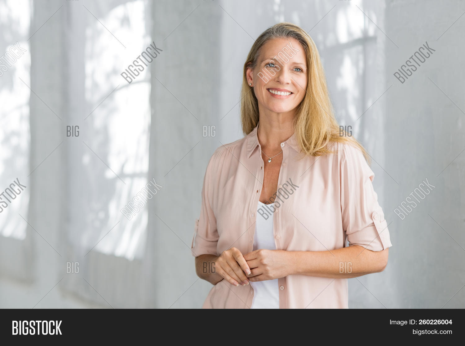aging,aspiration,attractive,beautiful,beautiful woman,beauty,blond,blonde hair,carefree,casual,caucasian,cheerful,confident,content,copy space,day dreaming,daydream,daydreaming,elderly,future,happy,healthy,home,hope,indoor,lady,lifestyle,looking away,mature,matured,middle aged woman,pensioner,people,planning,positive,relax,retired,retirement,senior,serene woman,smart casual,smile,standing,successful,thinking,toothy smile,vision,woman