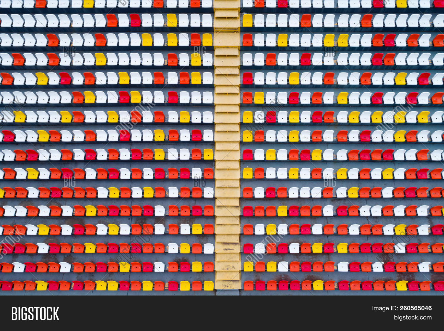 above,aerial,arena,audience,background,chair,color,competition,concert,empty,entertainment,event,football,game,gradient,horizontal,indoor,line,nobody,orange,outdoor,path,pattern,place,plastic,public,red,row,seat,section,soccer,sport,stadium,stairs,steps,top,tribune,venue,view,white,yellow