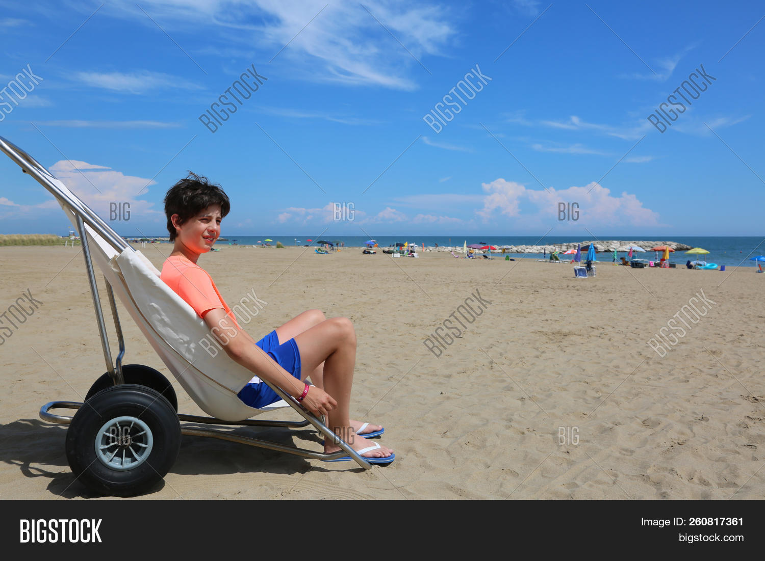 accessibility,adolescent,beach,boy,caucasian,chair,child,childhood,children,daycare,disability,disable,disabled,handicap,handicapped,health,healthcare,horizontal,illness,impairment,invalid,kid,lifestyle,medical,mobility,muscular,needs,outdoors,paralysis,paralyzed,paraplegic,patient,person,rehabilitation,sitting,special,summer,support,teenager,therapy,travel,wheel,wheelchair