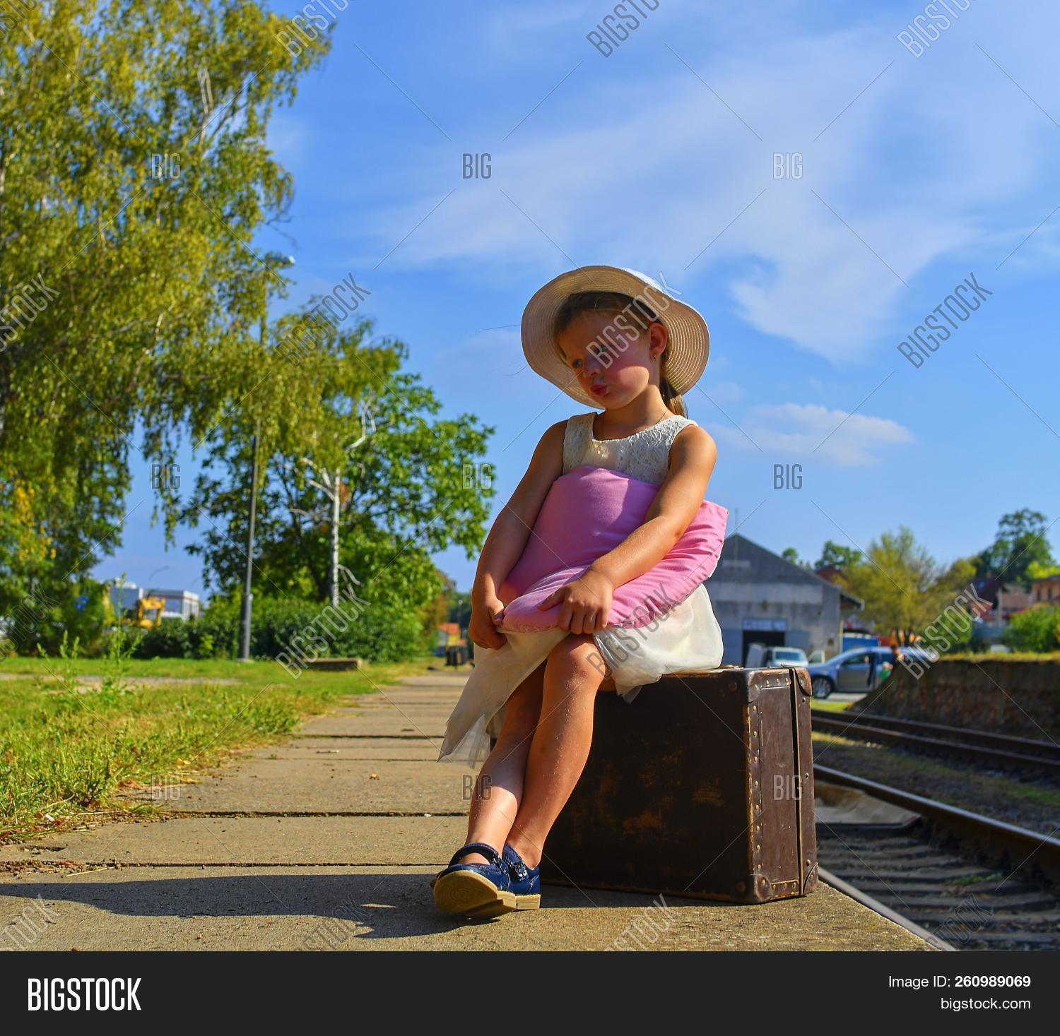 airport,arrival,baby,bag,bear,beautiful,beauty,business,caucasian,child,childhood,cute,day,departure,emotions,fashion,girl,happy,kid,little,luggage,old,outdoors,passenger,people,person,portrait,rail,railway,sad,scenic,shopping,sitting,sky,station,story,street,suitcase,summer,thailand,tourist,toy,train,travel,trip,vacation,waiting,white,woman,young