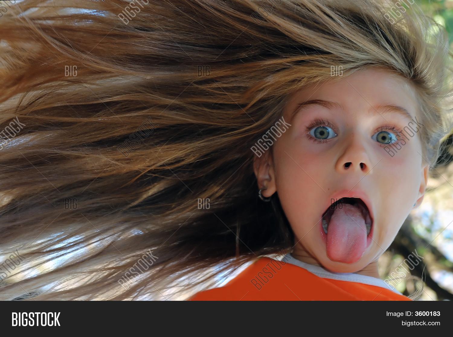 aside,beautiful,child,childhood,children,crazy,cute,face,fancy,flying,fun,funny,funny face,girl,hair,humorous,joke,joking,kid,kidding,long,mad,making,merry,one,people,portrait,preschooler,pretty,solo,tease,teasing,tongue