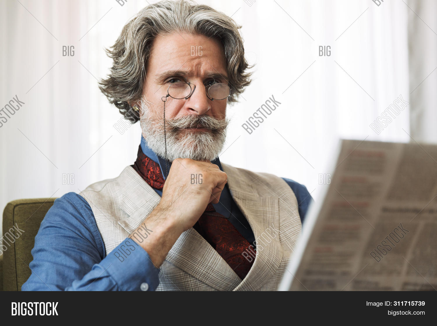 adult,aesthetic,alone,apartment,armchair,attractive,bearded,businesslike,businessman,caucasian,confident,elegant,eyeglasses,flat,formal,gray,grown,guy,handsome,home,hotel,indoor,job,male,man,masculine,mature,middle-aged,mustache,newspaper,older,portrait,professor,reading,room,serious,shirt,sitting,smart,standing,stylish,successful,suit,thoughtful,tie,unshaved