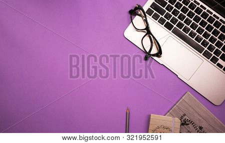 Light Laptop With Notebook And Pencil On Bright Purple Background Top View Stock Images Page Everypixel