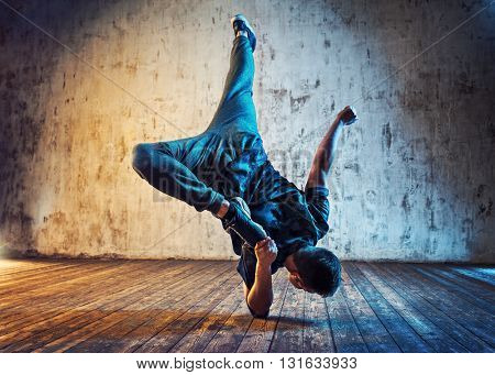 Young Man Break Dancing On Wall Background Blue And Red Lights Effect Image Stock Photo
