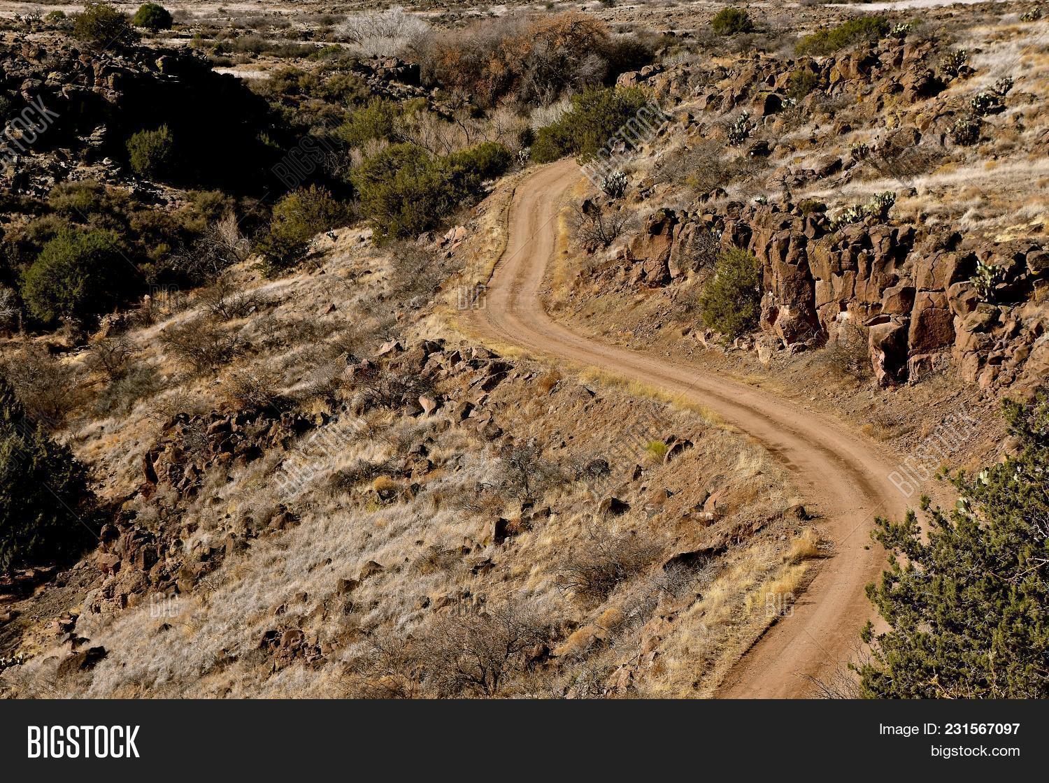 Arizona,boulders,byway,canyon,cliff,country,craggy,cruel,dangerous,desert,diet,drought,dry,graded,gravel,hill,hilly,land,landscape,lane,nature,path,road,rock,rocky,rugged,rural,sand,steep,terrain,west,western,winding