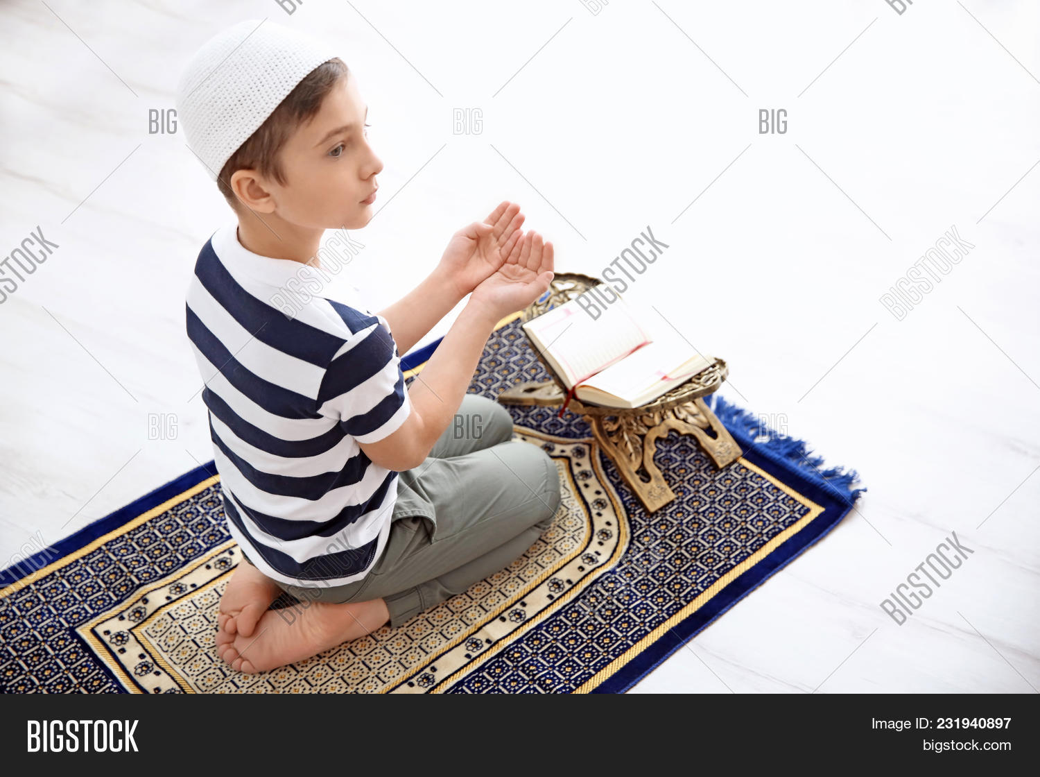 above,back,background,belief,book,boy,caucasian,child,childhood,culture,east,eastern,faith,floor,headdress,holy,home,indoors,islam,kid,koran,little,muslim,person,portrait,pray,prayer,quran,read,religion,religious,rug,salah,spiritual,spirituality,tradition,view