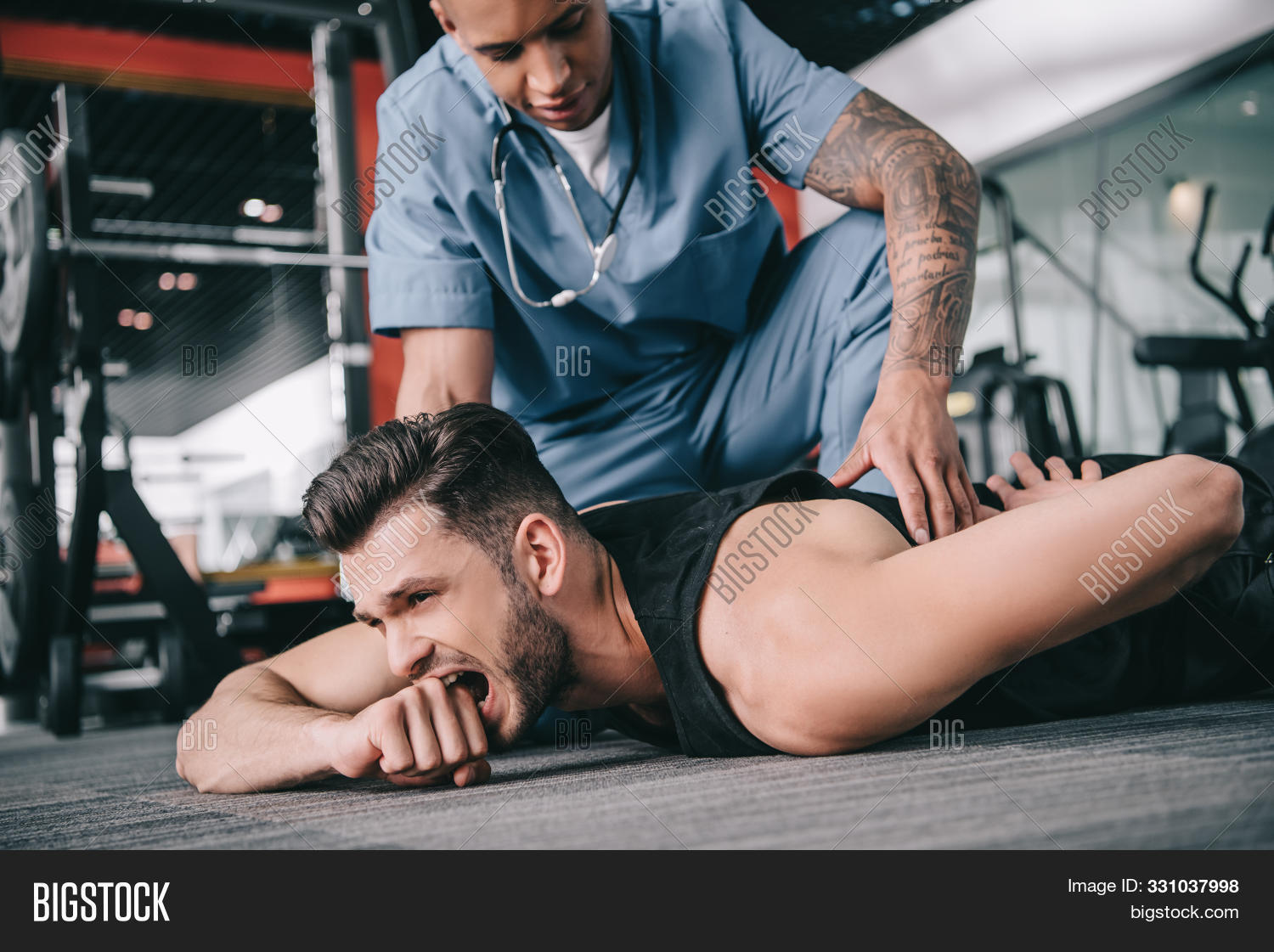 Medicare,activity,athlete,athletic,attentive,caucasian,doctor,equipment,european,examine,examining,exercise,fit,fitness,gym,handsome,health,healthcare,hurt,indoors,injured,injury,lying,medical,medicine,men,multicultural,multiethnic,pain,painful,profession,serious,sport,sporting,sportive,sportsman,sportswear,sporty,sthetoscope,suffer,tattoo,tattooed,training