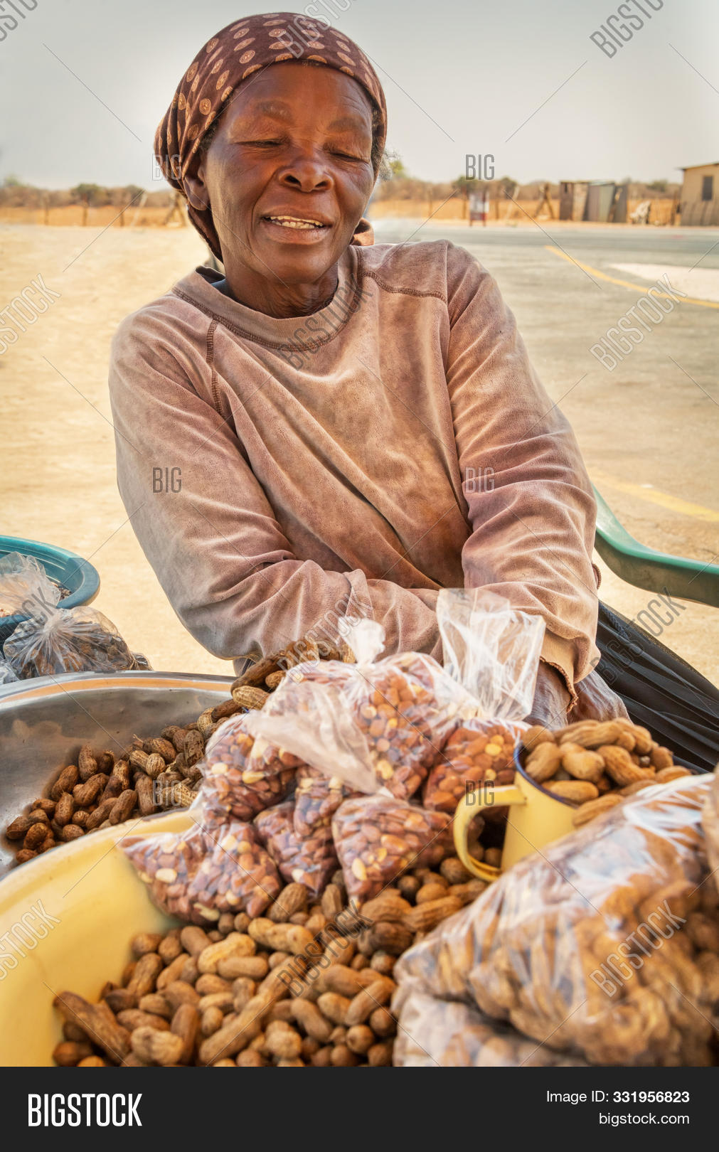 adult,africa,african,botswana,business,casual,commerce,consumerism,dealer,developing countries,dirty,female,food,hawker,issues,market,merchandise,merchant,misery,mopane,need,old,peanuts,people,person,poor,portrait,poverty,products,raw,retail,rural,settlement,shells,sitting,small business,society,street,street vendor,third world,township,trade,trader,traditional,unsanitary,vendor,village,woman,work,worms