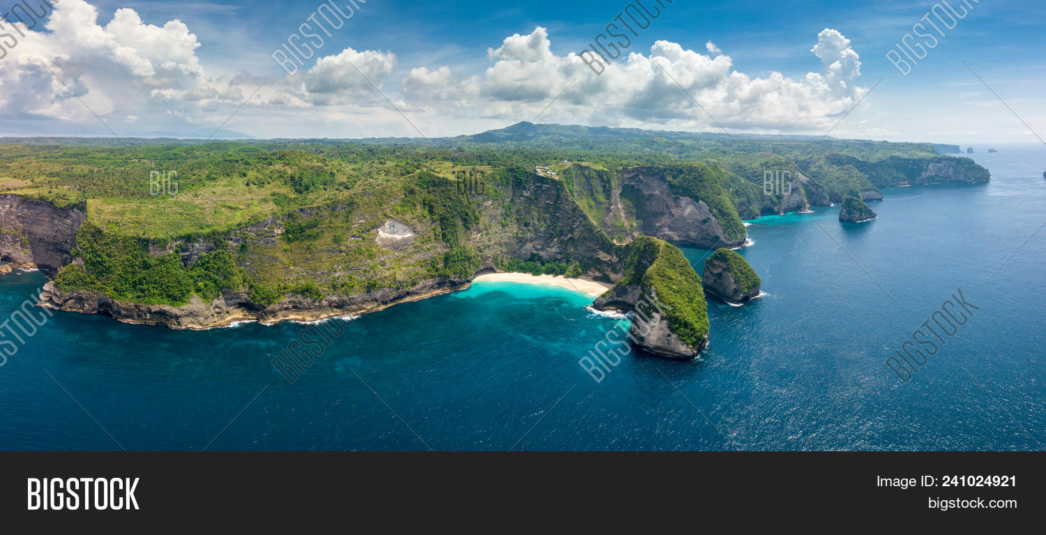 aerial,asia,bali,bay,beach,beautiful,birdview,blue,cape,cliff,cloudy,coast,coastline,drone,formation,geologic,green,holiday,idyllic,indonesia,island,kelingking,landscape,natural,nature,nusa,ocean,paradise,penida,point,reef,rock,rocky,sand,sea,seascape,shore,steep,top,tourism,travel,tropical,vacation,water,white,wild