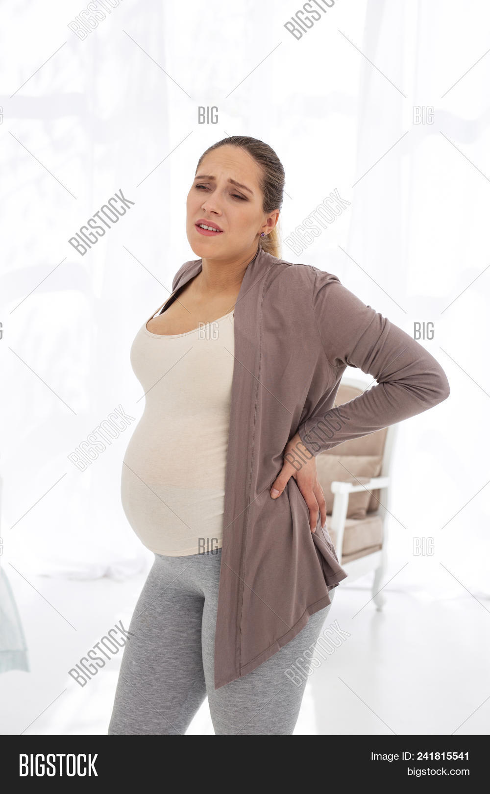 abdominal,abortion,adult,anticipation,attractive,back,backache,beautiful,belly,childbirth,concept,discomfort,domestic,expectant,family,generation,gynecology,hand,health,healthcare,home,hormonal,indoors,interior,leave,light,maternal,maternity,medical,mother,motherhood,pain,parent,parenthood,planning,pregnancy,pregnant,prenatal,problem,toxemia,toxicosis,trimester,tummy,woman,young,youth