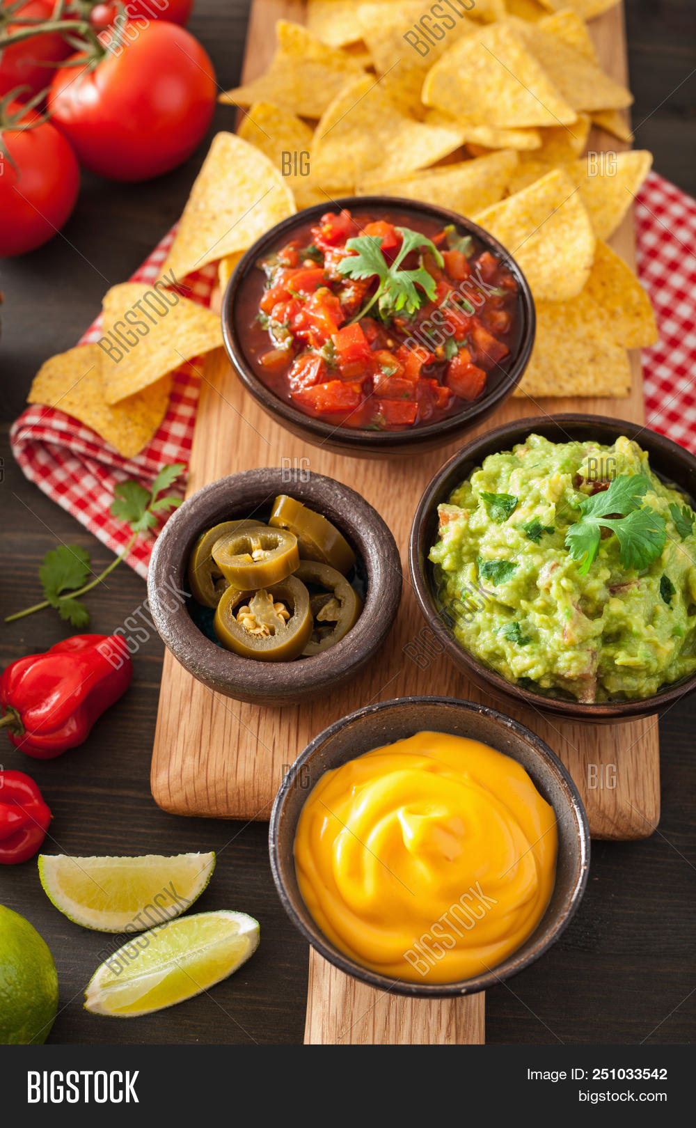 appetizer,avocado,cheddar,cheese,chip,cilantro,closeup,colorful,cooking,corn,cuisine,dark,dip,food,fresh,green,guacamole,health,healthy,herb,homemade,hot,ingredient,jalapeno,lime,lunch,meal,mex,mexican,nacho,onion,pepper,rustic,salsa,sauce,snack,spices,tasty,tex,tex-mex,tomato,tortilla,traditional,vegetable,vegetarian,wooden
