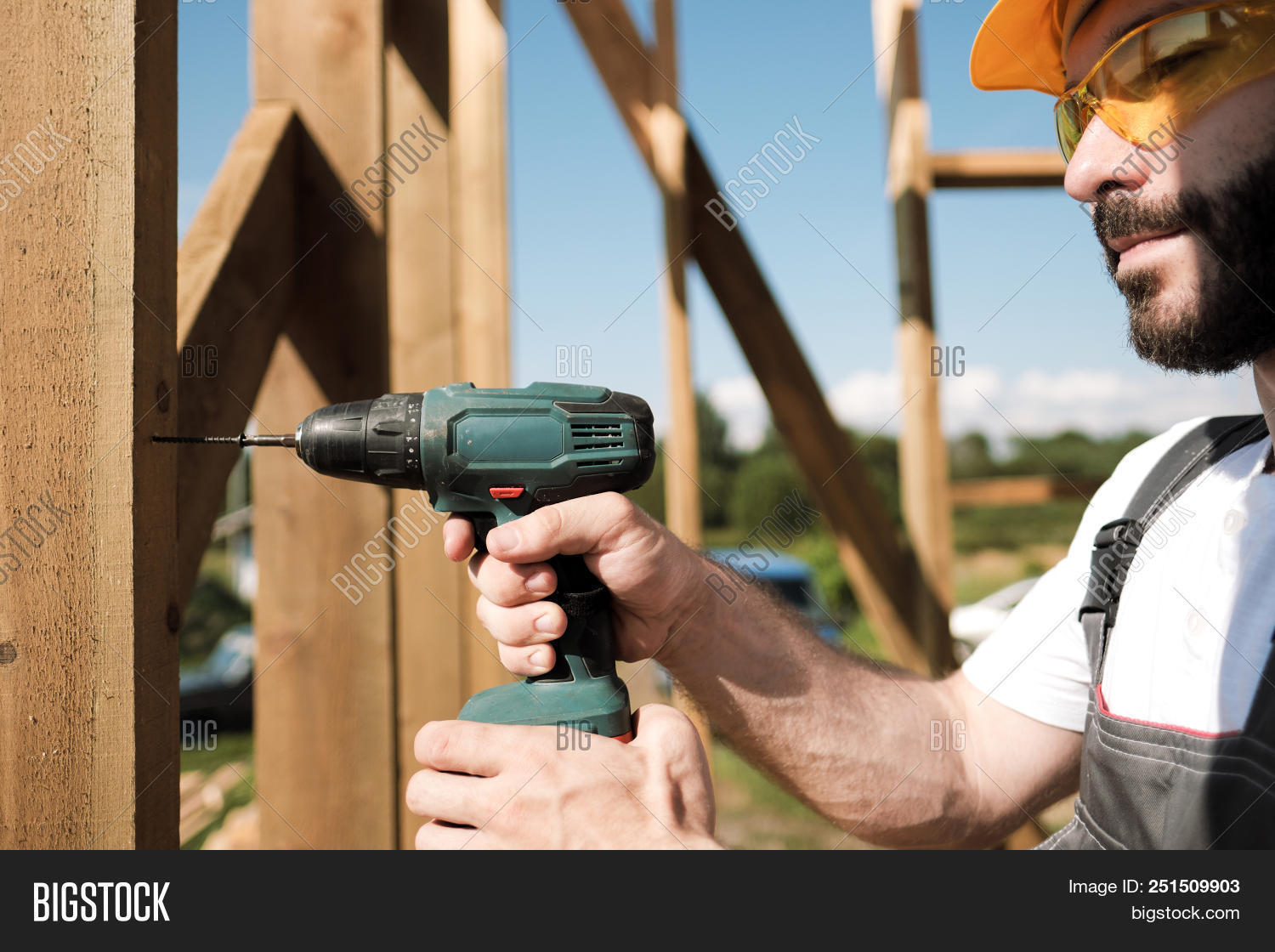 artisan,beams,builder,building,business,carpenter,caucasian,construction,contractor,development,drill,frame,hammer,hardhat,helmet,home,house,improvement,indoors,industry,job,lumber,making,male,men,nail,occupation,people,plank,profession,professional,real,repair,residentialstructure,roof,roof-trusses,roofer,roofing,screwdriver,site,structure,tool,wood,wooden,work,worker,working,yellow
