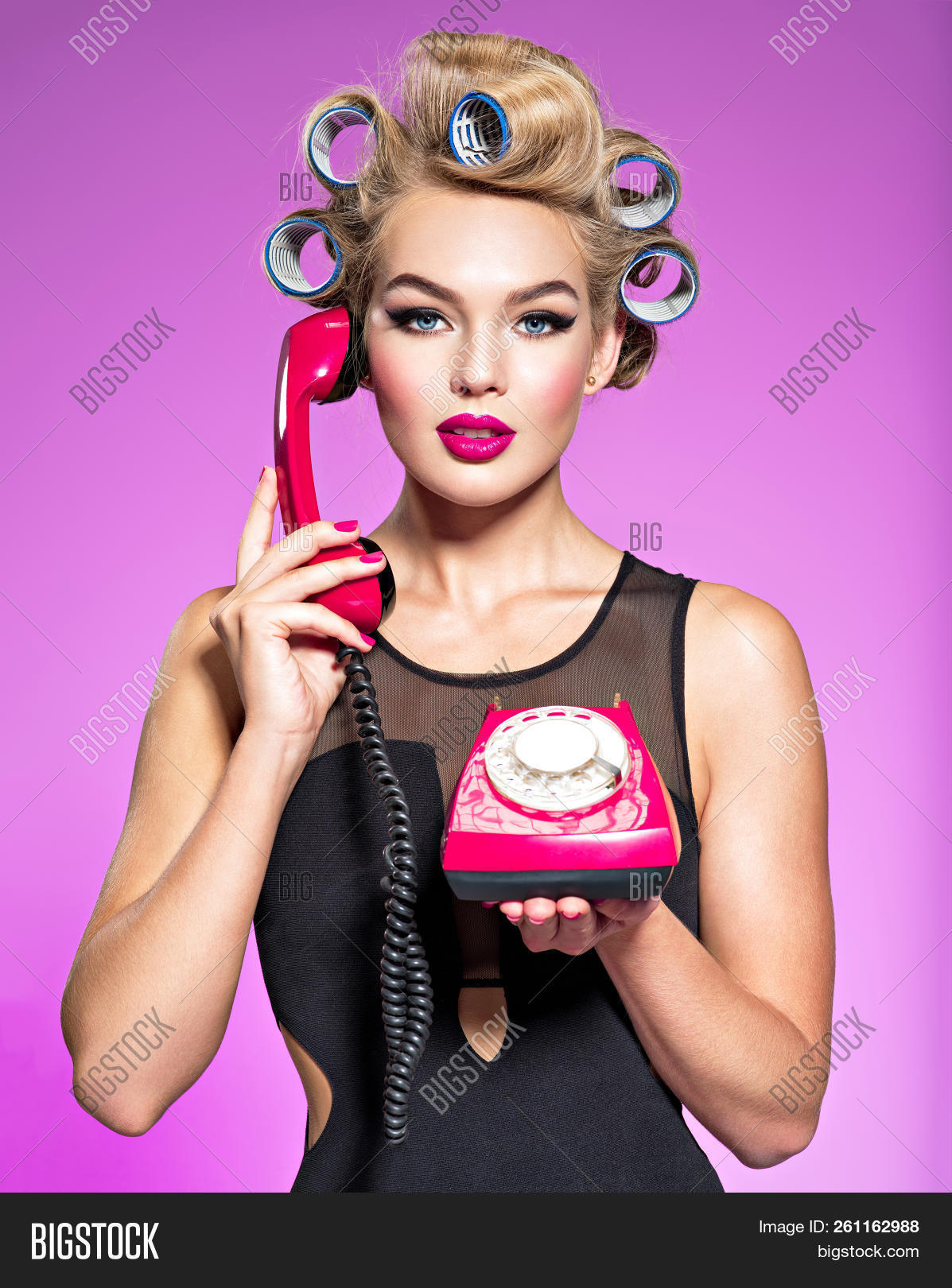 1950s,adult,attractive,background,beautiful,beauty,call,calm,caucasian,communication,curlers,emotionless,expression,face,fashion,female,girl,glamour,hair,looking,model,old,one,person,phone,plain,portrait,pretty,red,retro,showing,studio,style,talking,telephone,vintage,white,woman,young