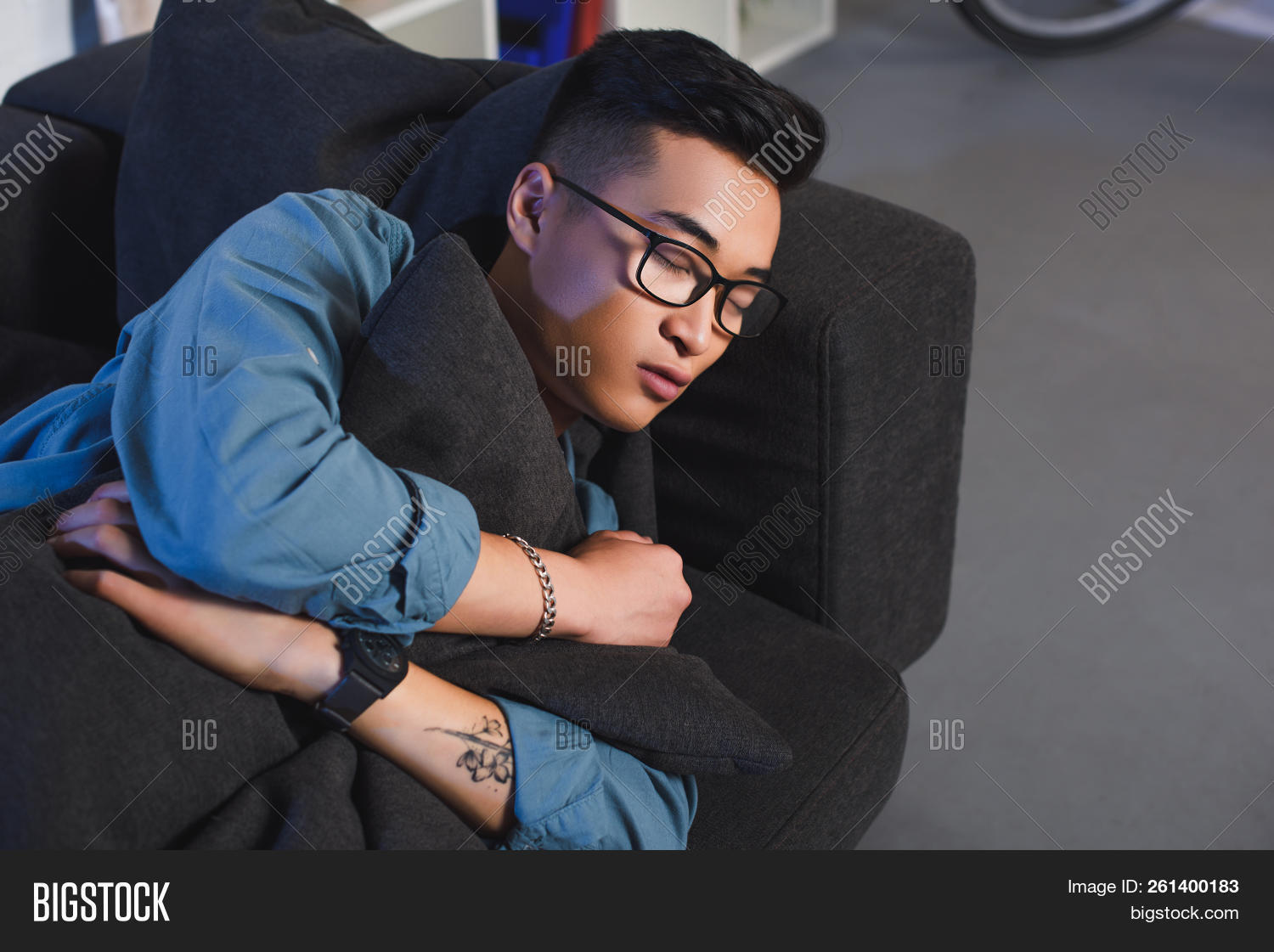 adult,angle,apartment,asian,at,casual,copy,couch,domestic,eyeglasses,handsome,high,home,homey,indoors,leisure,life,lifestyle,lying,male,man,millennial,one,people,person,rest,sleep,sleeping,sofa,space,spectacles,view,young