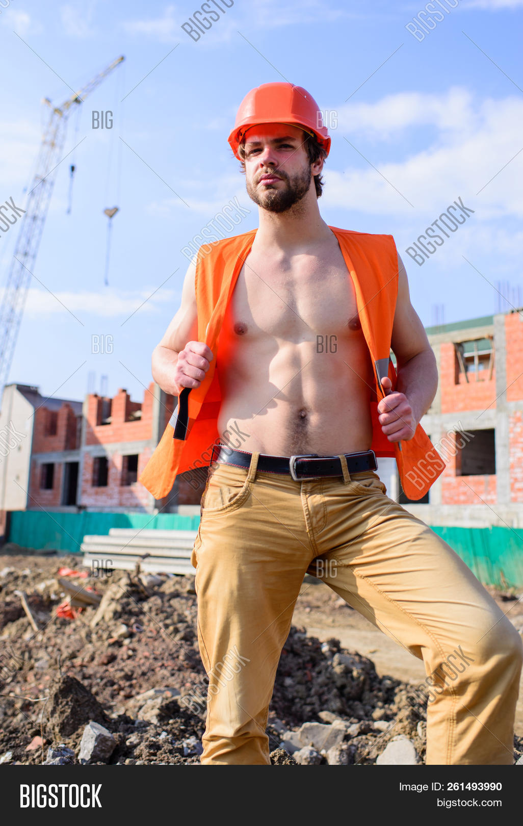attractive,background,beard,bearded,bricks,builder,building,caucasian,chest,concept,confident,construction,constructor,contractor,dream,every,face,foreman,front,guy,handsome,hard,hat,helmet,industrial,job,laborer,macho,man,muscular,occupation,orange,out,professional,protective,red,sexy,site,stand,torso,uniform,unshaven,vest,woman,work,worker,young