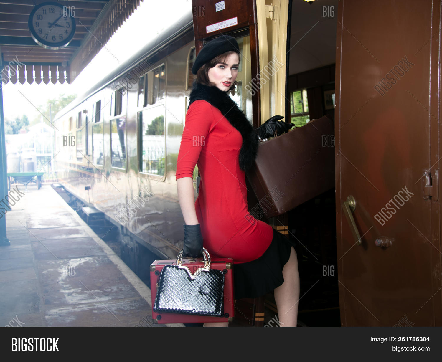 1920s,1930s,1940s,attractive,beautiful,beauty,beret,boarding,chic,classic,classical,classy,departing,departure,dress,elegance,elegant,fashion,fashionista,female,girl,hat,history,journey,lady,leaving,locomotive,luggage,makeup,nostalgia,old-fashioned,person,railway,red,retro,romantic,sitting,station,steam,style,stylish,suitcase,train,travel,vintage,waiting,woman,young