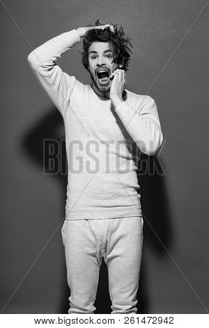 Surprised Or Scared Man With Disheveled And Uncombed Long Hair