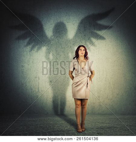 Funny Young Woman Hiding Hands Behind Her Back Looking Away. Full Length Female Portrait Casting A S