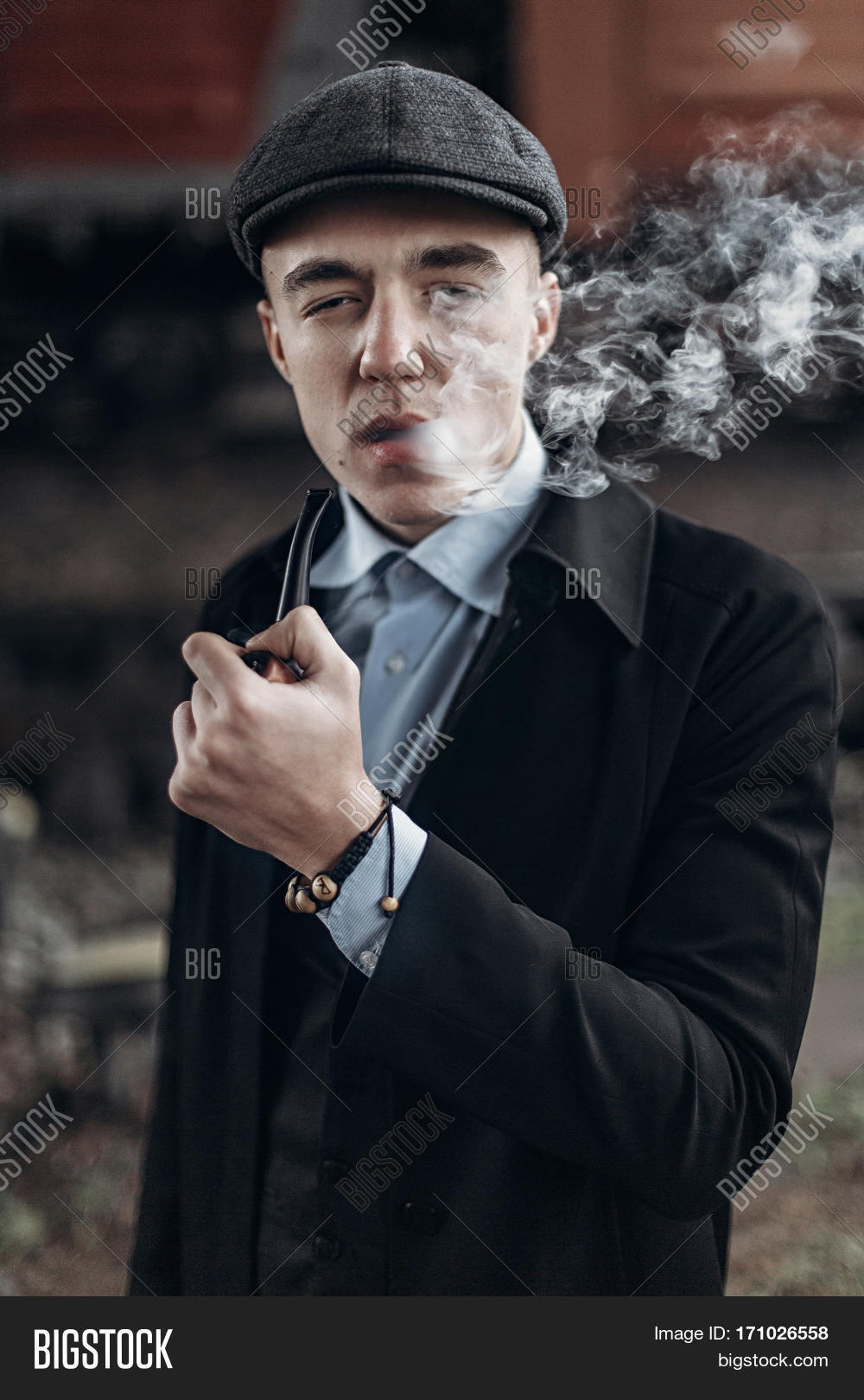 addiction,agent,atmospheric,blinders,british,cap,caucasian,character,classic,coat,confident,crime,detective,english,expression,fashionable,gangster,gentleman,guy,handsome,hat,hipster,holding,holmes,investigation,looking,male,man,mysterious,mystery,old-fashioned,peaky,people,person,pipe,portrait,posing,private,retro,serious,sherlock,silhouette,smoking,smoky,style,stylish,suit,tobacco,tweed,vintage