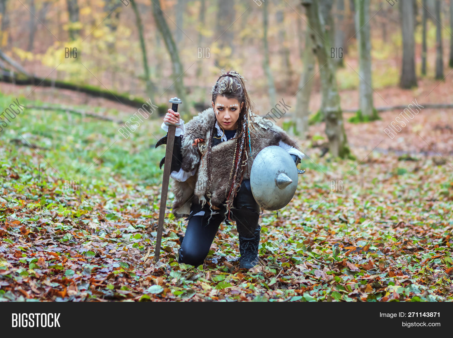 Scandinavian,Viking,Woman,aggressive,armed,background,barbarian,battle,beautiful,brunette,brutal,cinema,cinematic,collar,fight,forest,fur,furious,girl,hair,lagertha,makeup,movie,north,northern,people,ruthless,scary,shield,sword,threatening,war,warrior,weapon,wood,young