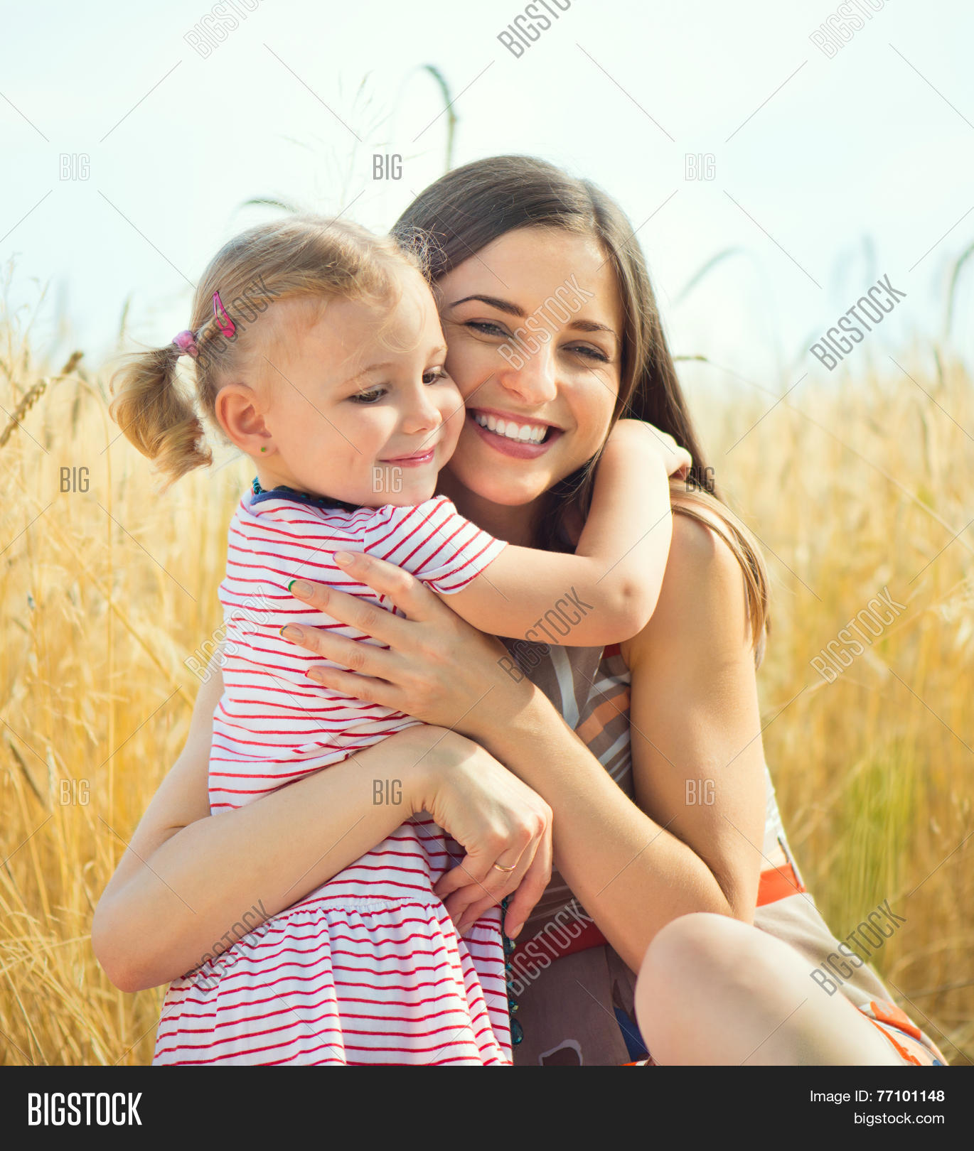 Pretty Young Mother With Daughter Are Happy In Sunny Day Image Stock Photo