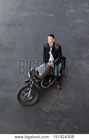 Top View To Brutal Man With Cafe Racer Custom Motorbike.