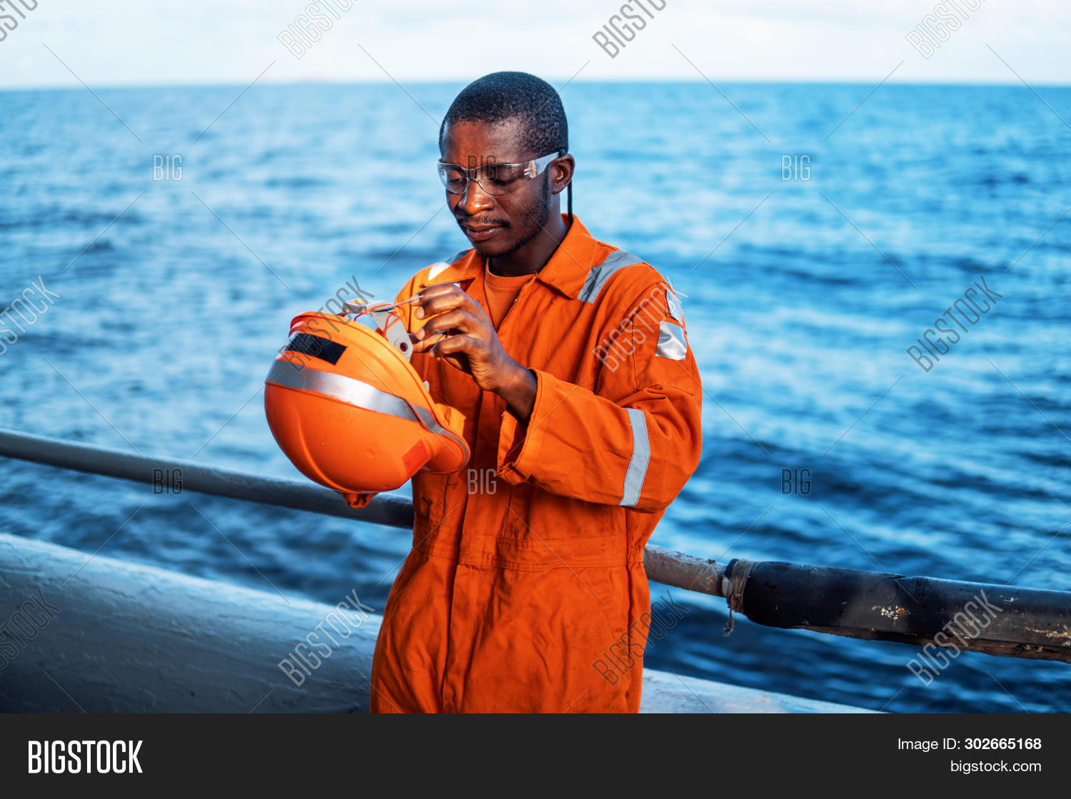 ab,ableseaman,african,ahts,black,bosun,chief,coverall,crew,deck,goggles,happy,helmet,industrial,industry,job,jobsafety,lifejacket,long,man,marine,maritime,offshore,oil,orange,ordinaryseaman,os,overall,professional,protection,protective,psv,sad,safety,sea,sealife,seaman,seawork,security,ship,smile,vessel,work,working