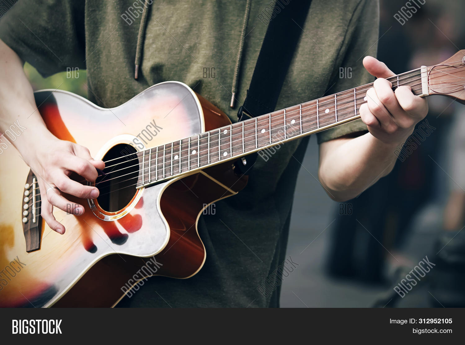 acoustic,arm,arrangement,black,bold,bright,chord,concert,creativity,fingers,fretboard,graceful,green,guitar,guitarist,hand,hobby,hole,improvisation,instrument,leitmotif,lifestyle,major,man,mediator,melody,minimalism,motive,music,musician,note,pastime,performance,play,player,playing,popular,profession,red,rock,six,skill,solo,sound,strap,string,sweatshirt,timbre,wood,youth