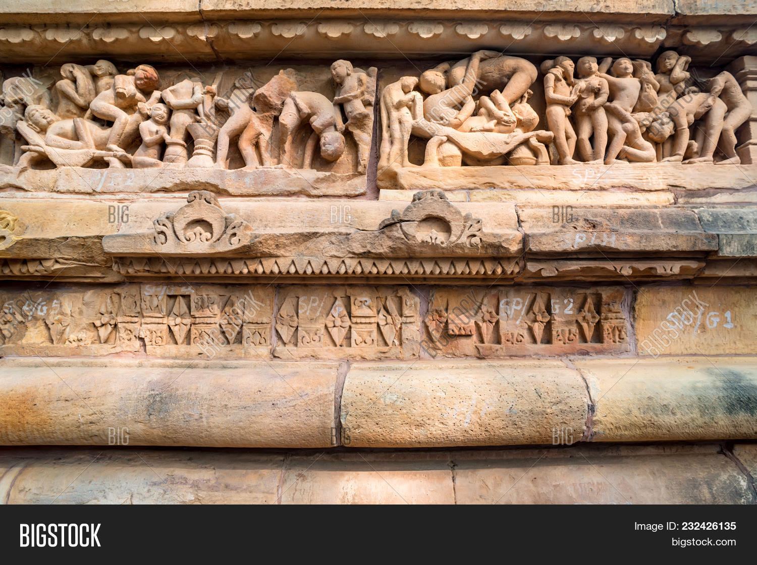 ancient,attraction,bas,bas-relief,building,carve,culture,editorial,erotic,exterior,famous,heritage,hindu,hinduism,historic,historical,history,india,indian,kama,kamasutra,khajuraho,lakshman,lakshmana,madhya,men,monument,old,ornate,outdoor,outside,people,pradesh,relief,religion,religious,sandstone,sculpture,sex,sexual,site,statuary,statue,stone,sutra,temple,tourism,tourist,travel