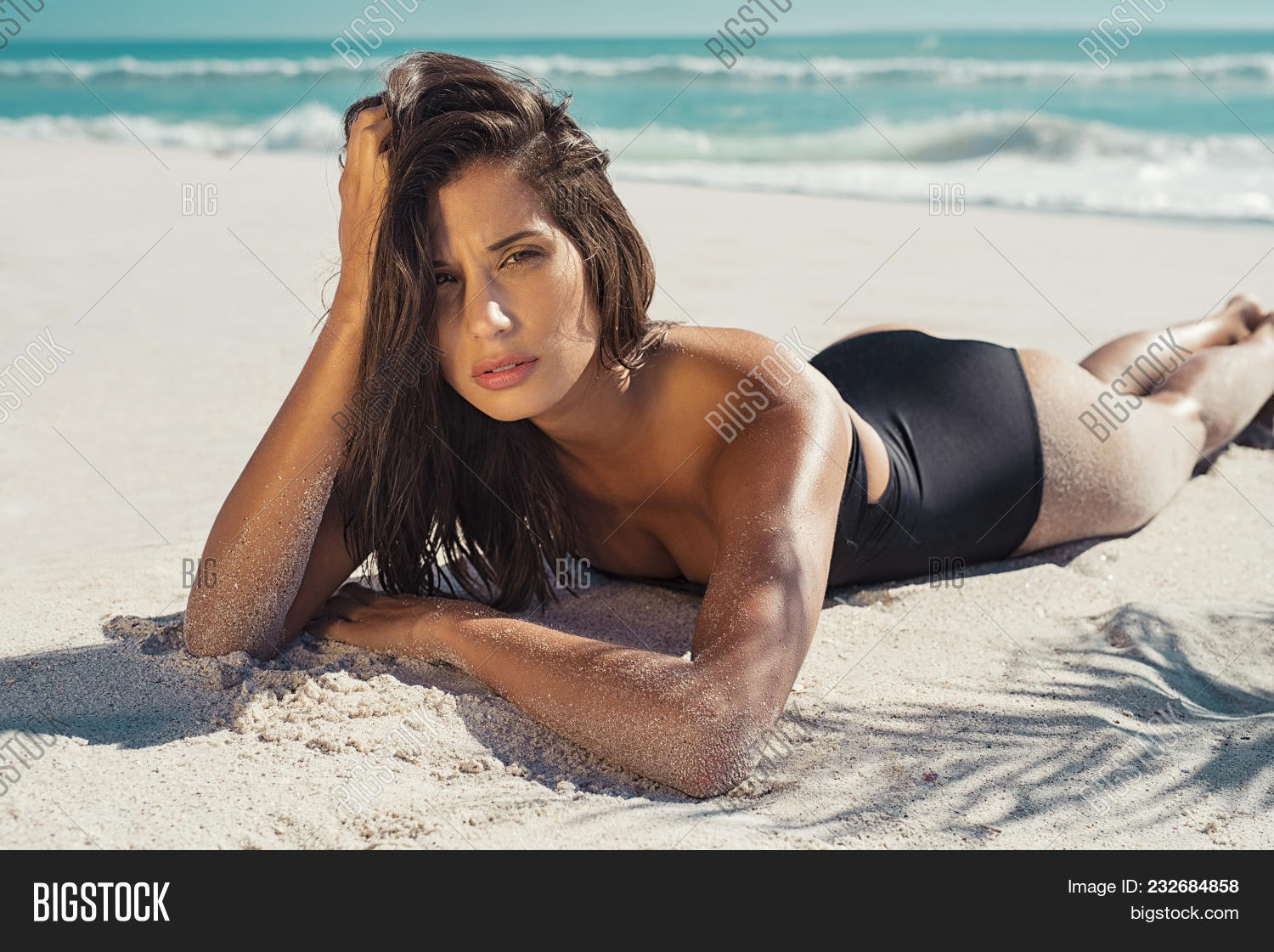 attractive,beach,beautiful,beauty,bikini,black,body,fashion,female,girl,glamour,hair,hispanic,latin,leaf,looking,looking at camera,luxury,lying,lying down,model,ocean,palm,sand,sea,sexy,shadow,style,stylish,summer,sunbath,sunbathing,swimsuit,swimwear,tan,tanned,tanning,tropical,vacation,water,white,woman,young