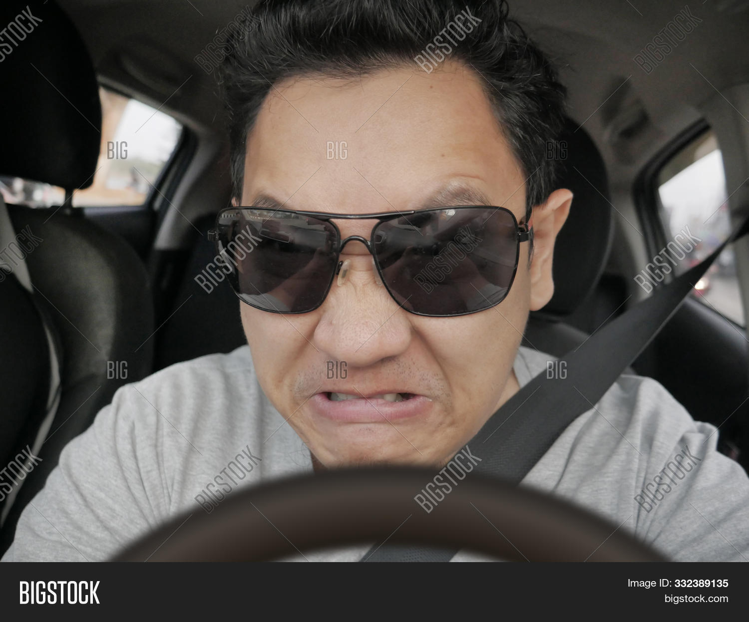accident,adult,aggressive,angry,annoyed,asian,auto,automobile,car,crazy,displeased,drive,driver,driving,emotion,enraged,expression,facial,fast,frustration,furious,fury,gesture,gesturing,indonesian,insurance,japan,mad,malaysian,male,man,nervous,person,rage,road,safety,scarry,speed,speeding,steering,stress,thai,traffic,transport,transportation,upset,vehicle,violence,young