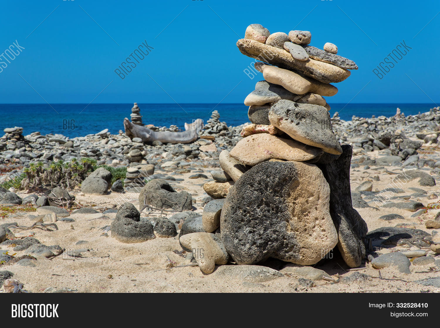 Antilles,Bonaire,Netherlands,arrangement,background,balance,beach,blue,boulders,build,coast,coastal,cobbles,cobblestones,concept,construct,construction,destination,fossils,group,heap,horizon,island,landscape,natural,nature,objects,ocean,outdoors,outside,pebbles,pile,piled,scene,sea,seashore,seaside,shore,sign,sky,stack,stacked,stones,summer,symbol,symbolic,touristic,travel,vacation,water