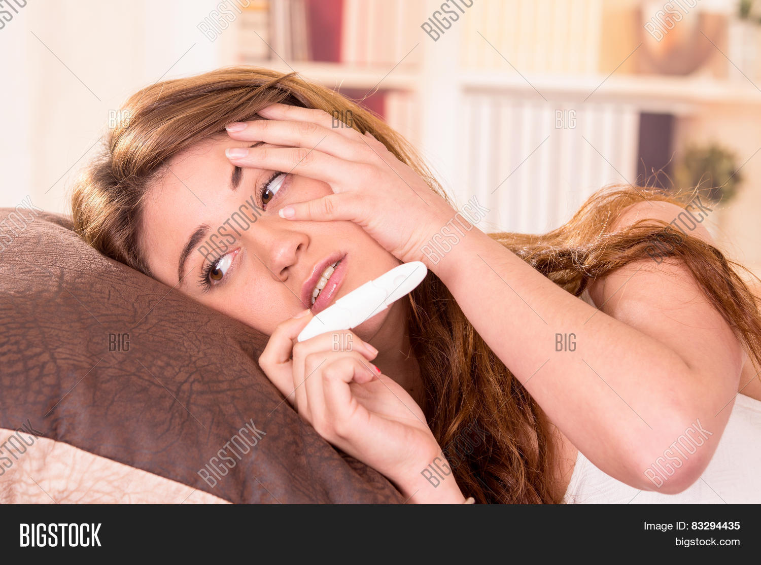 nervous beautiful young girl holding pregnancy with her hand on her ...