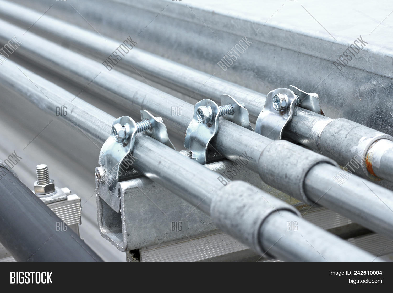 accessories,assembly,bolts,cable,clamp,coated,conduit,construction,electric,electrical,emt,equipment,fittings,fix,images,imc,industrial,industry,installation,metal,mounting,nuts,objects,photo,pictures,pipe,plated,pv,rail,roof,rooftop,screw,sheet,solar,standards,steel,stock,structure,support,tube,wire,zinc