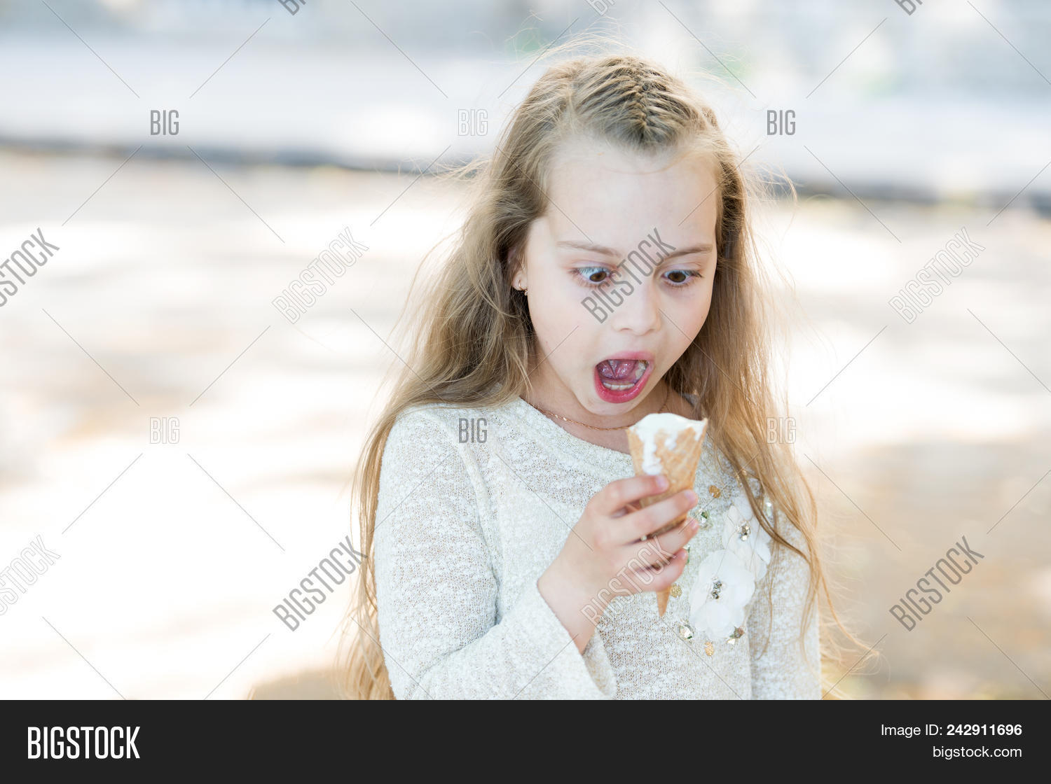adorable,baby,background,calorie,child,childhood,childrens,concept,cone,cream,cute,day,diet,dieting,eat,enjoy,face,flavour,food,girl,hair,hand,happiness,health,healthy,hold,ice,international,kid,light,like,little,long,love,nourishment,nutrition,shocked,small,sugar,summer,sweet,sweettooth,taste,tooth,treats,waffle,white