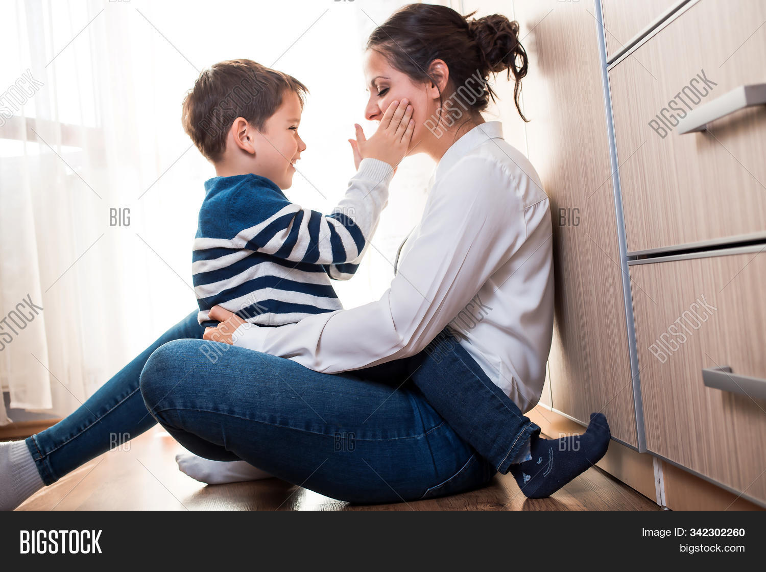adorable,adult,affection,affectionate,beautiful,blue,boy,care,caucasian,cheerful,child,childhood,cute,family,female,fun,happiness,happy,holding,home,hug,indoors,joyful,kid,kiss,lap,leisure,lifestyle,little,mom,mother,motherhood,parent,parenthood,parenting,people,playing,portrait,relationship,sitting,smile,smiling,son,tenderness,together,two,white,woman,young