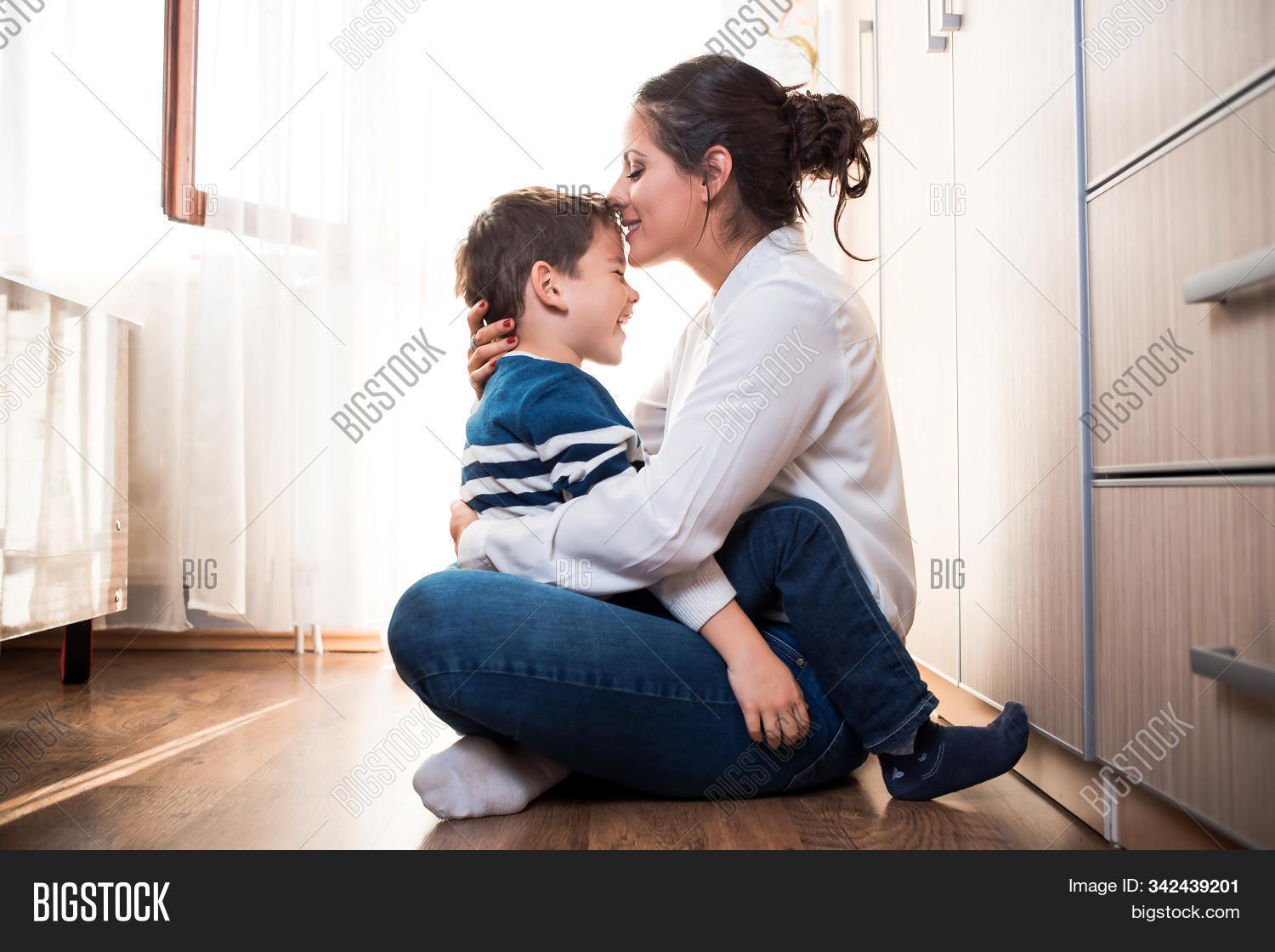 adorable,adult,affection,affectionate,beautiful,blue,boy,care,caucasian,cheerful,child,childhood,cute,family,female,fun,happiness,happy,holding,home,hug,indoors,joyful,kid,kiss,lap,leisure,lifestyle,little,mom,mother,motherhood,parent,parenthood,parenting,people,playing,portrait,relationship,sitting,smile,smiling,son,tenderness,together,two,white,woman,young