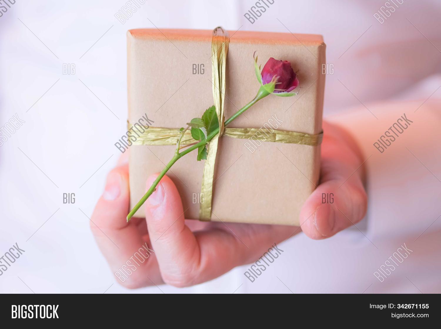 14th,8th,adult,anniversary,background,beautiful,birthday,box,business,celebration,christmas,closeup,concept,craft,day,decoration,decorative,elegant,event,fabruary,flower,gift,give,giving,hand,happy,holding,holiday,love,male,man,march,men,package,paper,person,pink,present,red,rose,shirt,surprise,trendy,valentine,white,wrapped,xmas